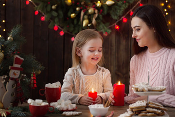 Wall Mural - Mother and little girl with christmas cookies  at home