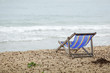 © Golden House Images - Beach chair on white sand with sea wave and sunny. Relaxing on the beach.