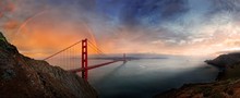 Panoramic View Of The Golden Gate Bridge With A Rainbow At Sunset And Orange-glowing Storm Clouds, San Francisco, California, United States, North America