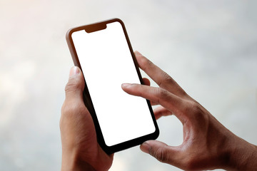 mock up smartphone of hand holding black mobile phone with blank white screen