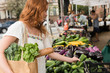 © jamie grill photography/Stocksy - Woman shopping at farmer's market