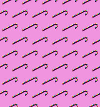 Rainbow-colored Candy Canes On A Magenta Background
