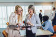 © Mediteraneo - Business team of women with tablet pc computer at office. Selective focus.