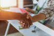 © Subhakitnibhat - Two confident business man shaking hands during a meeting in the office, success, dealing, greeting and partner concept.