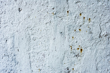 Texture of a concrete wall with cracks and scratches which can be used as a background