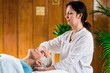 © Microgen - Marma Therapy. Ayurveda Practitioner with Patient
