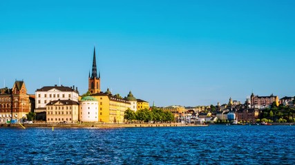 Wall Mural - Stockholm, Sweden. Time-lapse of Gamla Stan in Stockholm, Sweden with landmarks like Riddarholm Church during the sunny summer day. View of old buildings