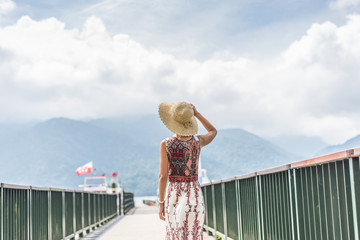 traveling Asian woman with hat