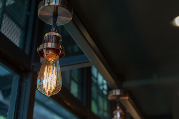 Wall Mural - Close up of Illuminated light bulb with copy space.