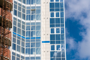 A new residential building on monolithic frame technology in the area with the existing infrastructure. Facade of ceramic tiles and glass.