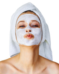 Wall Mural - young woman with facial mask on her face. skin care and treatment, spa, natural beauty and cosmetolo
