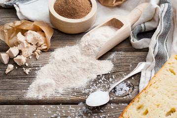 slice of bread and ingredients on old weathered wooden table