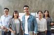 © saksit - Portrait of Asian creative business team. Hipster Creative Startup Young business people in modern office.
