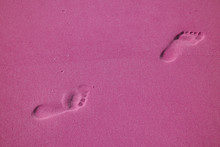 Pop Art Styled Woman's Walking Footprints On The Sand Beach In Magenta Color