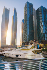 Sticker - Dubai, UAE United Arabs Emirates. Dubai marina skyscrapers and yachts at sunset. Apartments, hotels and office buildings, modern residential development of UAE