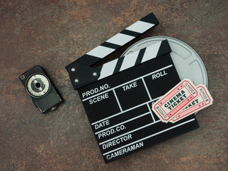 Clapperboard and cinema tickets