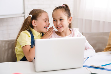Poster - Classmates whispering and using laptop after lesson