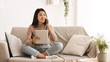© Prostock-studio - Girl Calling Friend, Using Digital Tablet at Home