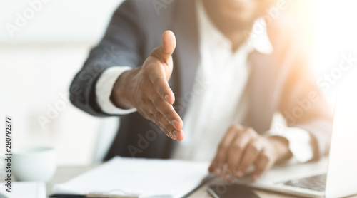 Fotomural African businessman gives hand for handshake proposes partnership