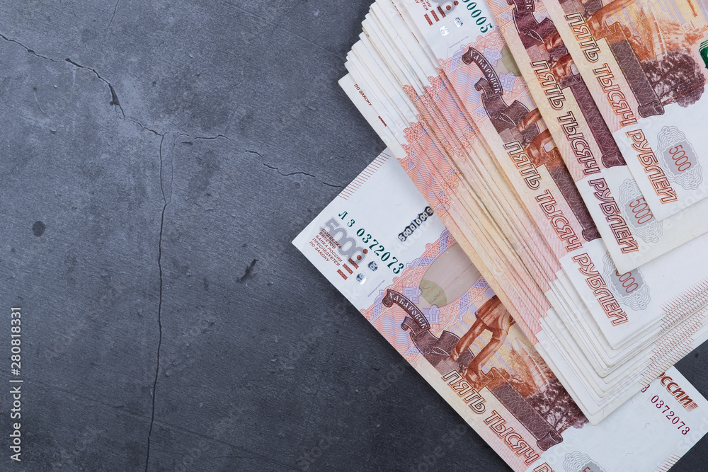 Russian Rouble Banknote Stack Big stack of Russian money banknotes of five thousand rubles lying on a ...