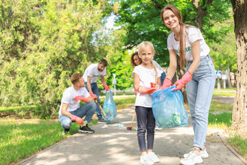 Wall Mural - Volunteers gathering garbage in park