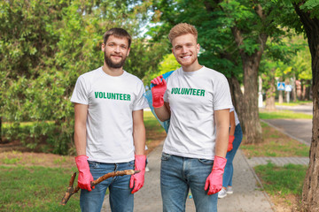 Wall Mural - Volunteers gathering garbage in park