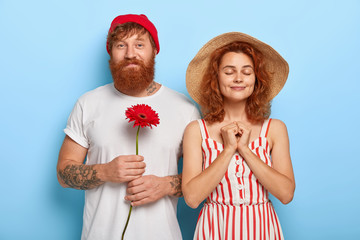 people, closeness, love concept. handsome bearded red haired boyfriend has date with sweetheart, hol