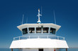 front view of  the navigation cabine on a passenger ship on blue sky background