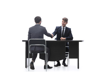 handshake business people sitting at the table
