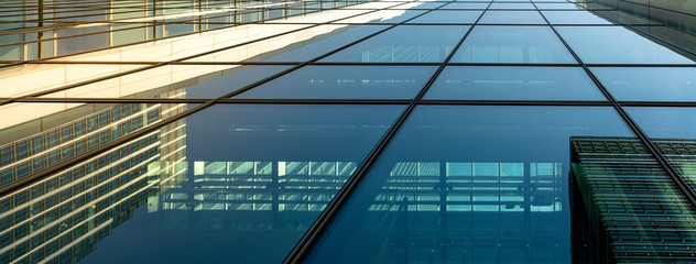 Modern city building architecture with glass fronts on a clear day in London, England panoramic