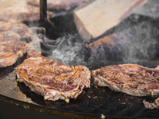 Cooking bbq grill beef open fire in summer festival