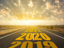 Long Asphalt Road And New Year 2019, 2020 ,2021, 2022, 2023 Concept. Driving On An Empty Road In The Asphalt To Upcoming 2018, 2019, 2020 And Leaving Behind Old Years.
