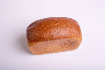 Gray bread on a white background. Insulated Baking Loaf