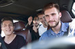 © ASDF - Group of happy friends on a car