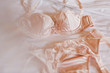 Close-up beige lingerie lying on the bed, the concept of the wedding night, selective focus