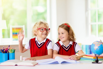 Wall Mural - Kids doing homework. Children go back to school.