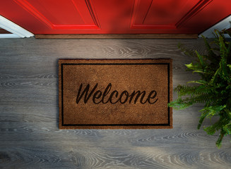 Wall Mural - Overhead view of welcome mat outside inviting front door of house