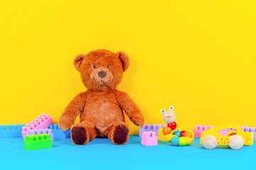 Baby kid toys collection on blue and yellow background