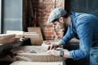 © opolja - Successful handsome businessman with stylish cap work in carpentry