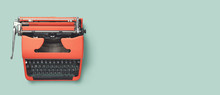 Retro Banner Or Header Image With Red Vintage 60s / 70s Typewriter On A Bright Turquoise Background, Top View, Copyspace For Your Text