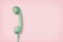 Mint Colored Vintage Phone Receiver On A Pink Background, Retro Background, Copyspace For Your Text