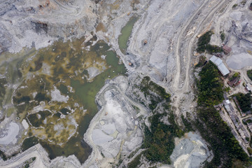  huge open-pit granite quarry, view from drone, cloudy day.