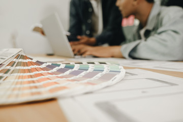 Graphic designers work together with computer designing application for mobile phone, Graphic designers concept