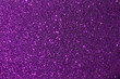 Dark purple color shiny glitter texture background with vibrant color