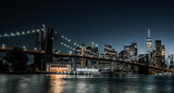 Fototapeta  - Brooklyn Bridge as night just starts to fall over New York City