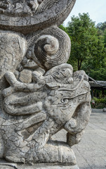 Wall Mural - Stone dragon head scultpure close-up