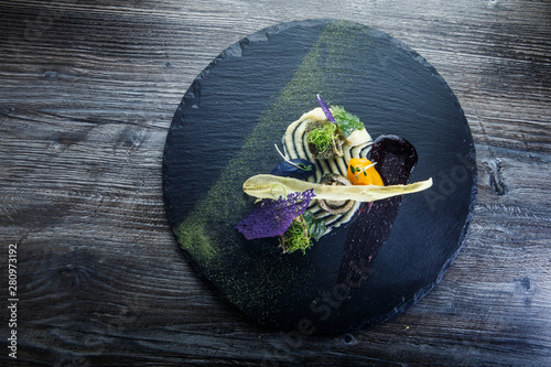 Fotomural top view of beautifully decorated fish rolls stuffed with herbs