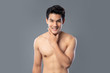 Portrait of shirtless smiling handsome Asian man