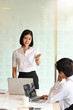 © Prathankarnpap - Young Businesswoman present in meeting room.