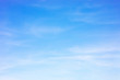 Leinwandbild Motiv Blue sky background and white clouds soft focus, and copy space